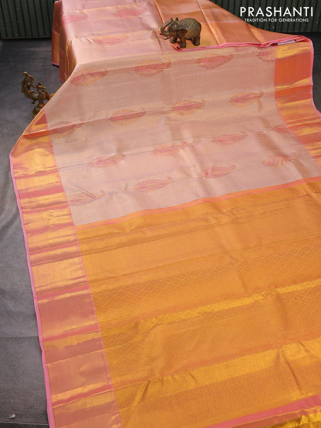 Pure kanchipuram tissue silk saree dual shade of peach pink with allover zari woven brocade weaves and zari woven border