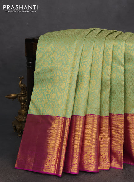 Pure kanchipuram silk saree light green and purple with allover zari woven brocade weaves and long zari woven border