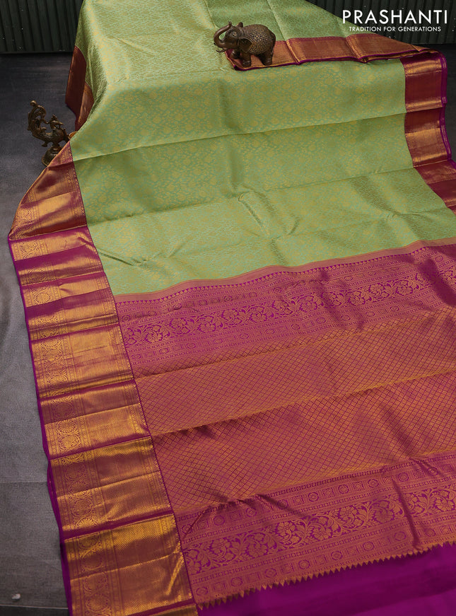 Pure kanchipuram silk saree light green and purple with allover zari woven brocade weaves and long zari woven border