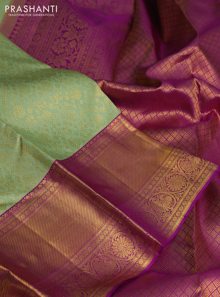 Pure kanchipuram silk saree light green and purple with allover zari woven brocade weaves and long zari woven border