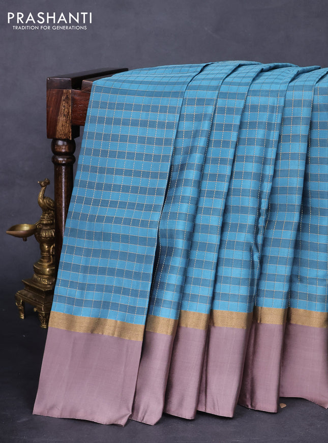Kanchipuram silk saree pastel blue and brown with allover zari checked pattern and zari woven simple border