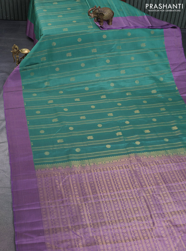 Kanchipuram silk saree teal green shade and pastel purple with allover zari weaves & buttas and zari woven checked border