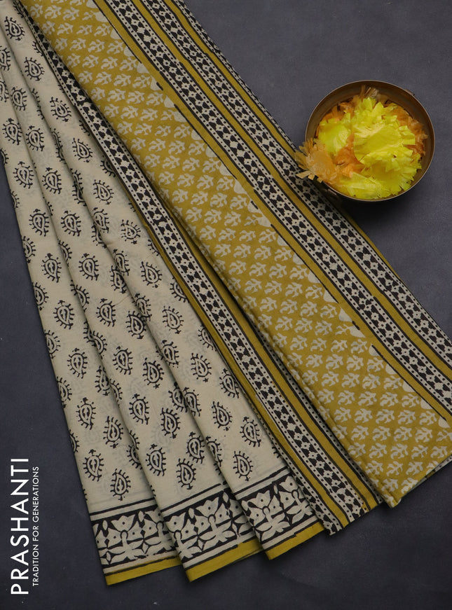 Jaipur cotton saree cream and yellow with allover pailsey buttas and printed border