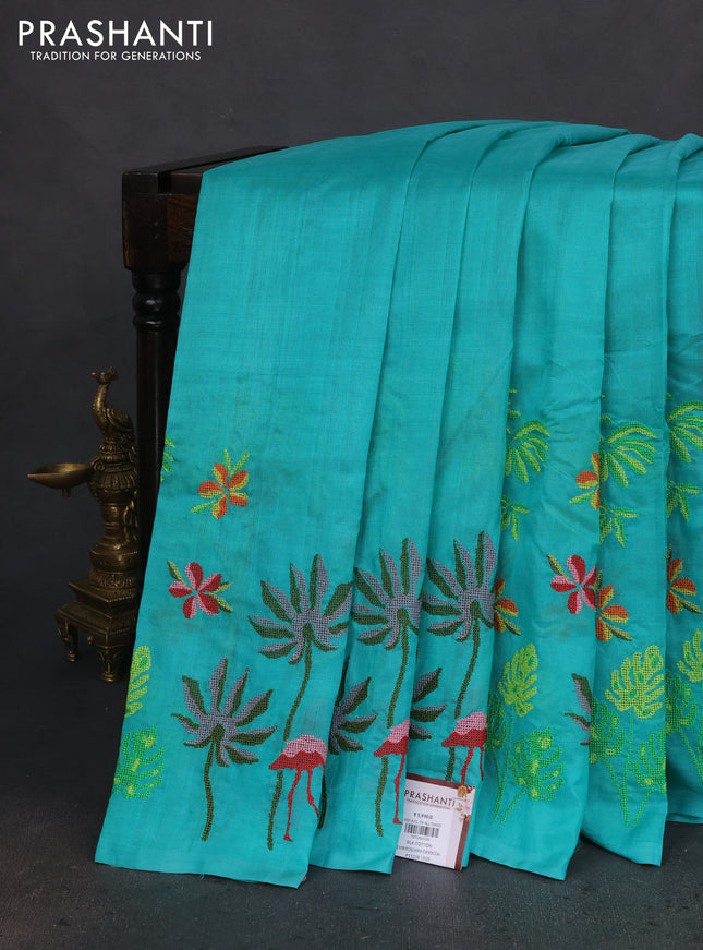 Silk cotton saree teal green with plain body and long kutchi embroidery border