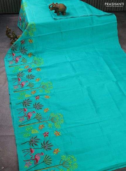 Silk cotton saree teal green with plain body and long kutchi embroidery border