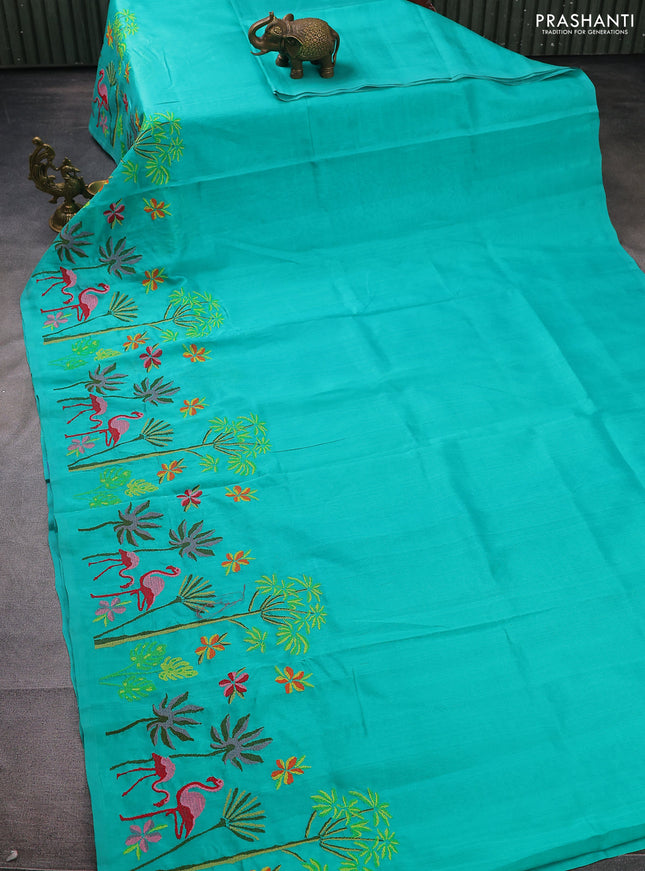 Silk cotton saree teal green with plain body and long kutchi embroidery border