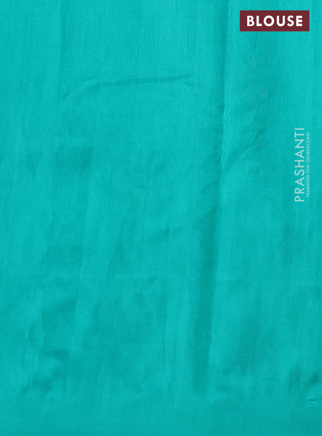 Silk cotton saree teal green with plain body and long kutchi embroidery border