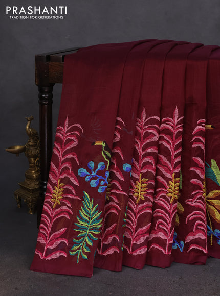 Silk cotton saree wine shade with plain body and long kutchi embroidery border