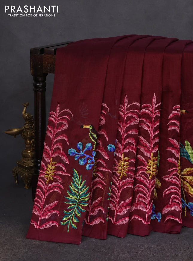 Silk cotton saree wine shade with plain body and long kutchi embroidery border