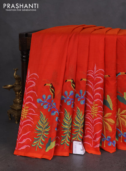 Silk cotton saree orange with plain body and long kutchi embroidery border