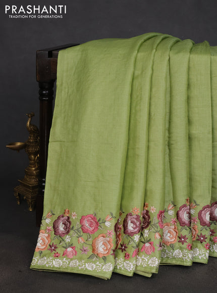 Pure tussar silk saree light green with plain body and floral design embroidery work border