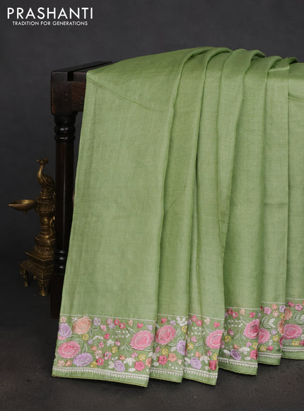 Pure tussar silk saree light green with plain body and floral design embroidery work border