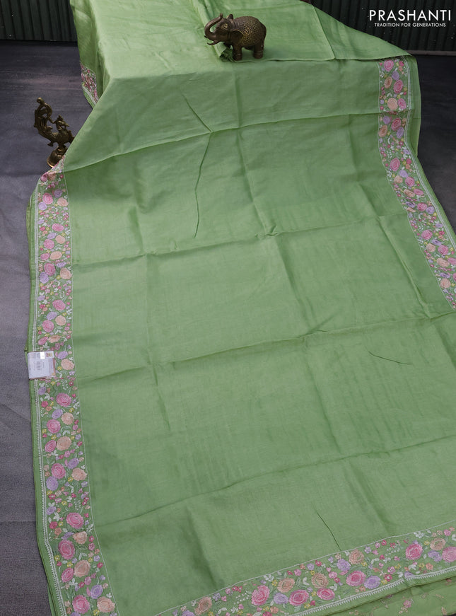 Pure tussar silk saree light green with plain body and floral design embroidery work border