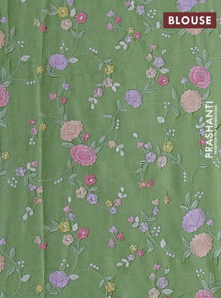 Pure tussar silk saree light green with plain body and floral design embroidery work border