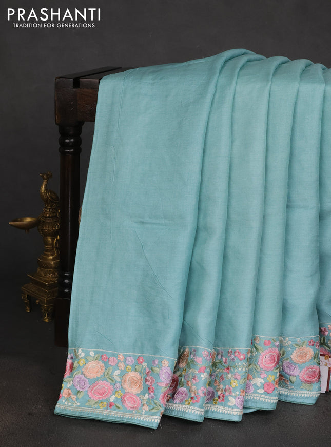 Pure tussar silk saree teal blue with plain body and floral design embroidery work border