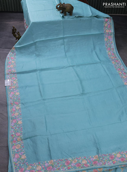 Pure tussar silk saree teal blue with plain body and floral design embroidery work border