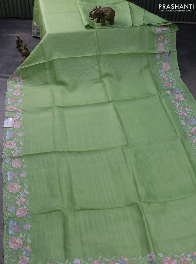 Pure tussar silk saree light green with plain body and floral design embroidery work border