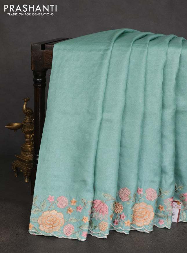 Pure tussar silk saree teal blue with plain body and floral design embroidery work border