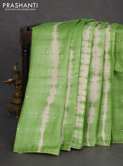 Pure tussar silk saree light green and beige with tie & dye prints & pita work and embroidery pallu