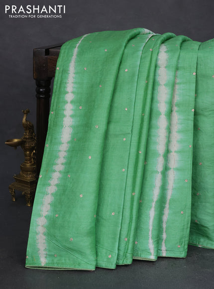 Pure tussar silk saree light green and beige with tie & dye prints & pita work and embroidery pallu