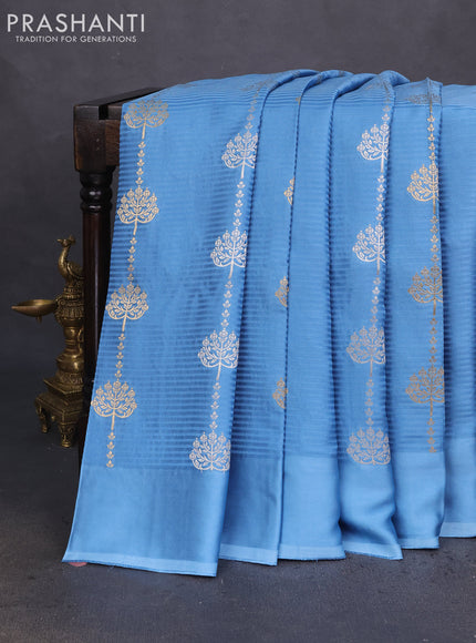 Banarasi mushru silk saree light blue with allover stripes pattern & zari buttas and satin border