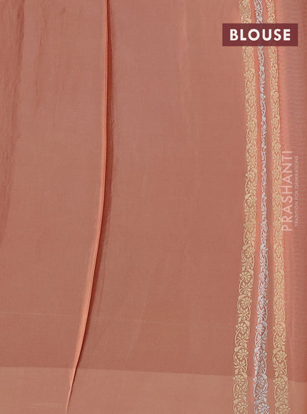 Banarasi mushru silk saree pale orange with allover stripes pattern & zari buttas and satin border