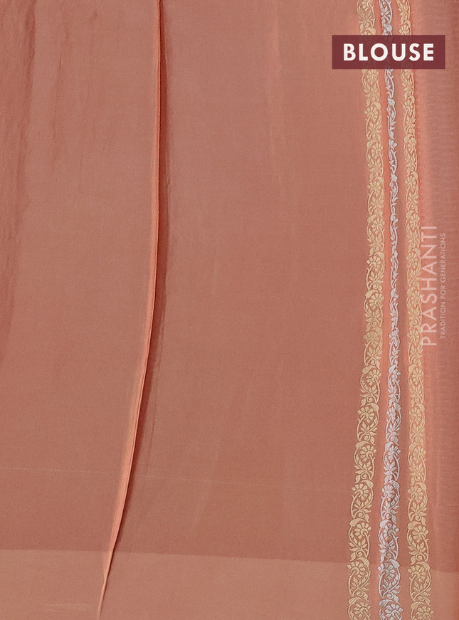 Banarasi mushru silk saree pale orange with allover stripes pattern & zari buttas and satin border