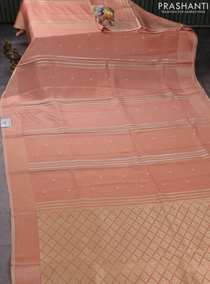 Banarasi mushru silk saree peach shade with allover stripes pattern & zari weaves and satin border