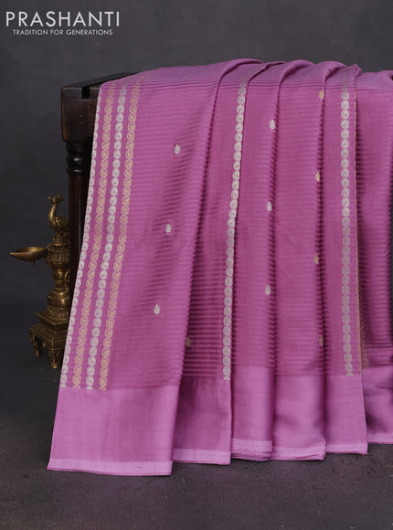 Banarasi mushru silk saree lavender with allover stripes pattern & zari weaves and satin border