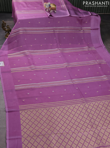 Banarasi mushru silk saree lavender with allover stripes pattern & zari weaves and satin border