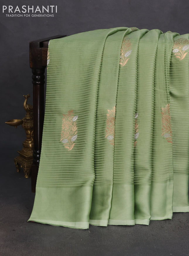 Banarasi mushru silk saree pastel green with allover stripes pattern & zari weaves and satin border