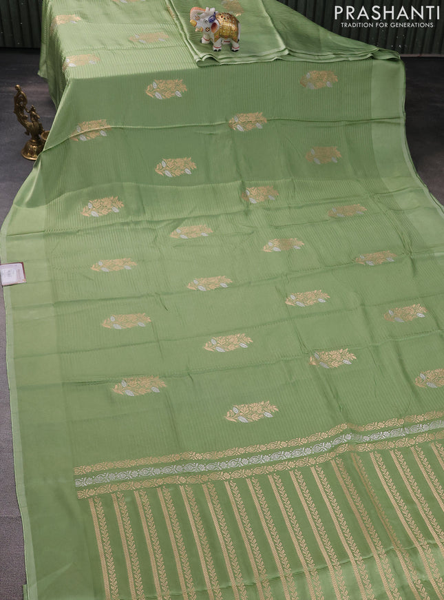 Banarasi mushru silk saree pastel green with allover stripes pattern & zari weaves and satin border
