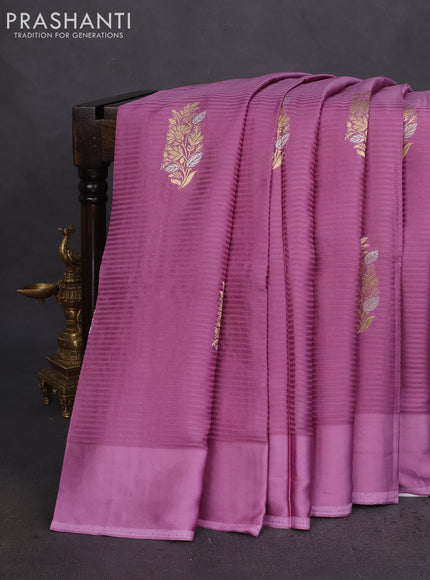 Banarasi mushru silk saree mild lavender with allover stripes pattern & zari weaves and satin border