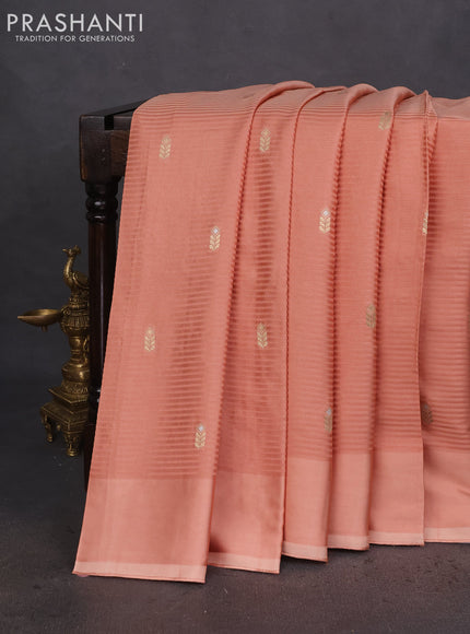 Banarasi mushru silk saree pale orange with allover stripes pattern & zari weaves and satin border
