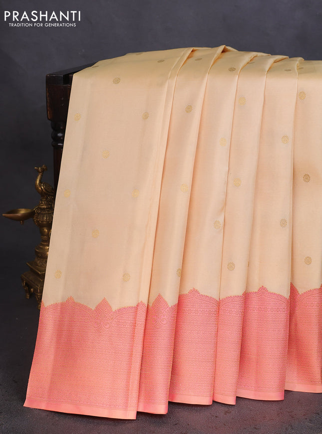 Pure kanchipuram silk saree cream and dual shade of peach with zari woven buttas and rich zari woven border