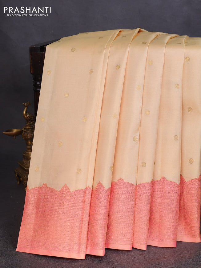 Pure kanchipuram silk saree cream and dual shade of peach with zari woven buttas and rich zari woven border