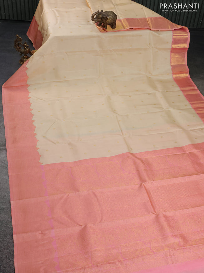 Pure kanchipuram silk saree cream and dual shade of peach with zari woven buttas and rich zari woven border