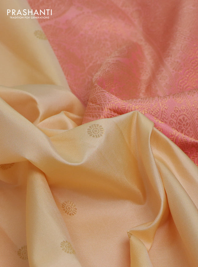Pure kanchipuram silk saree cream and dual shade of peach with zari woven buttas and rich zari woven border