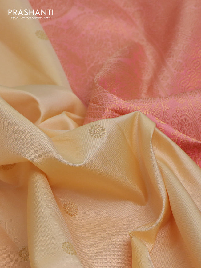 Pure kanchipuram silk saree cream and dual shade of peach with zari woven buttas and rich zari woven border