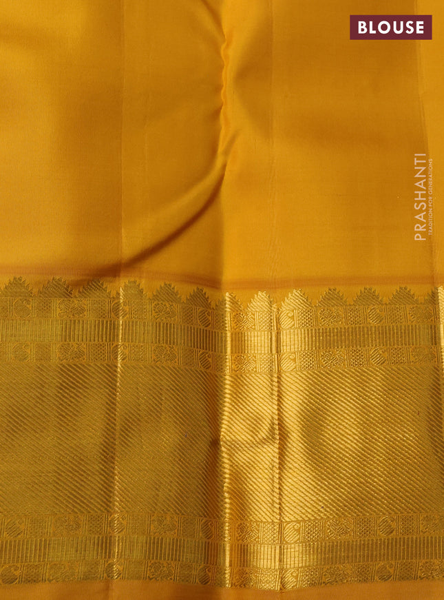 Pure kanchipuram silk saree blue and yellow with zari woven buttas and rich zari woven korvai border