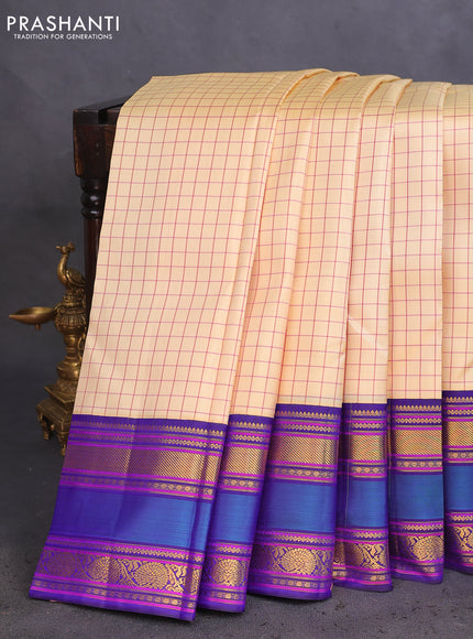 Pure kanchipuram silk saree cream and blue with allover checked pattern and rettapet zari woven border