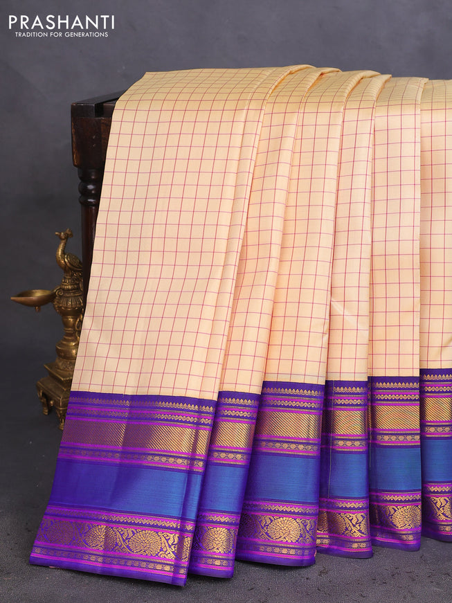 Pure kanchipuram silk saree cream and blue with allover checked pattern and rettapet zari woven border