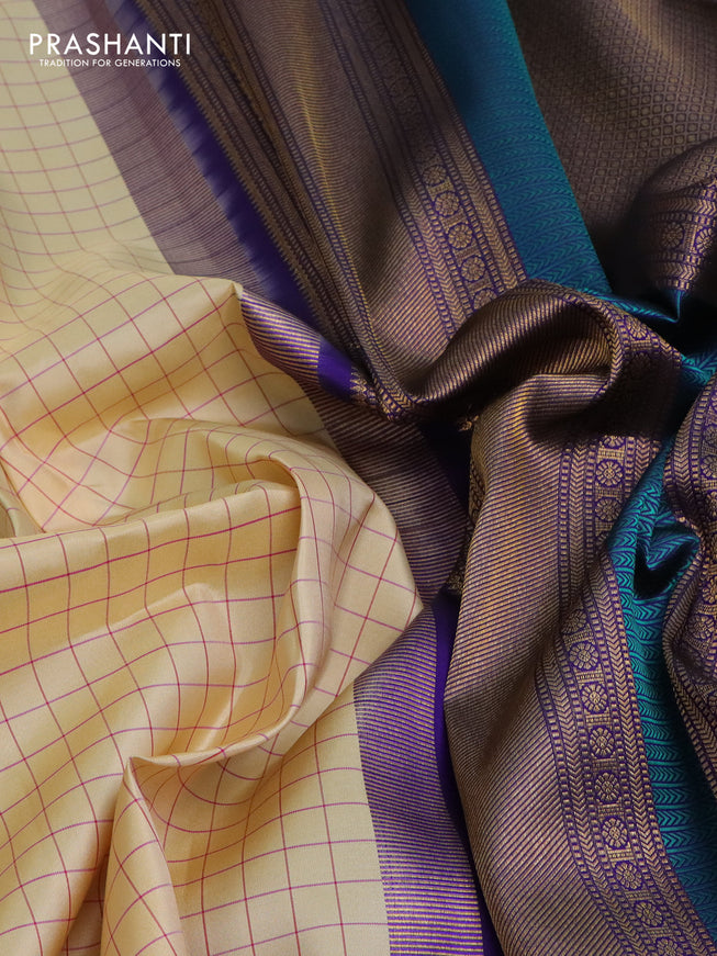 Pure kanchipuram silk saree cream and blue with allover checked pattern and rettapet zari woven border