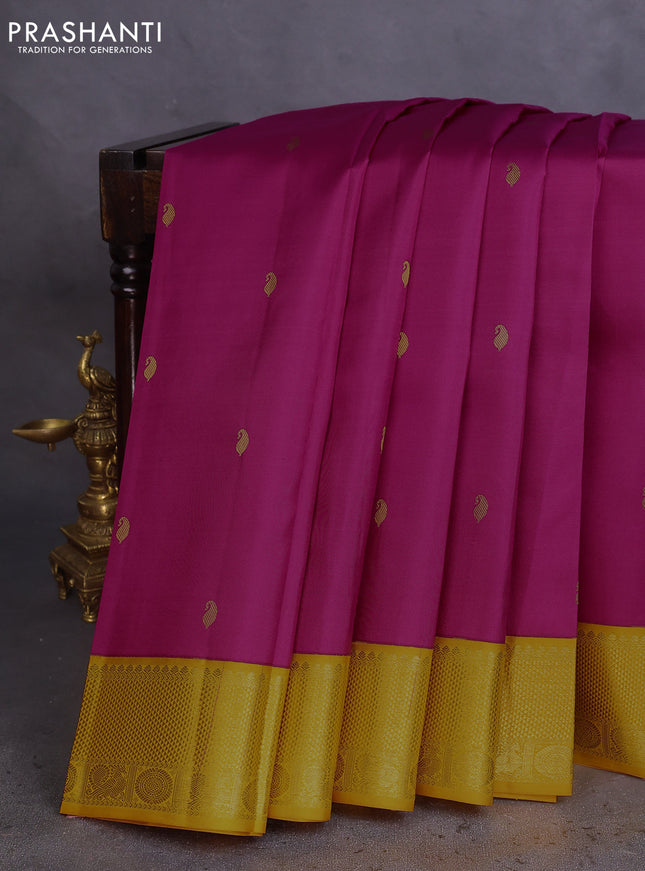 Pure kanchipuram silk saree magenta pink and mustard yellow with paisley zari woven buttas and rich zari woven border