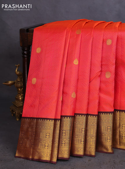 Pure kanchipuram silk saree dual shade of pinkish orange and coffee brown with allover zari stripe & buttas and zari woven korvai border