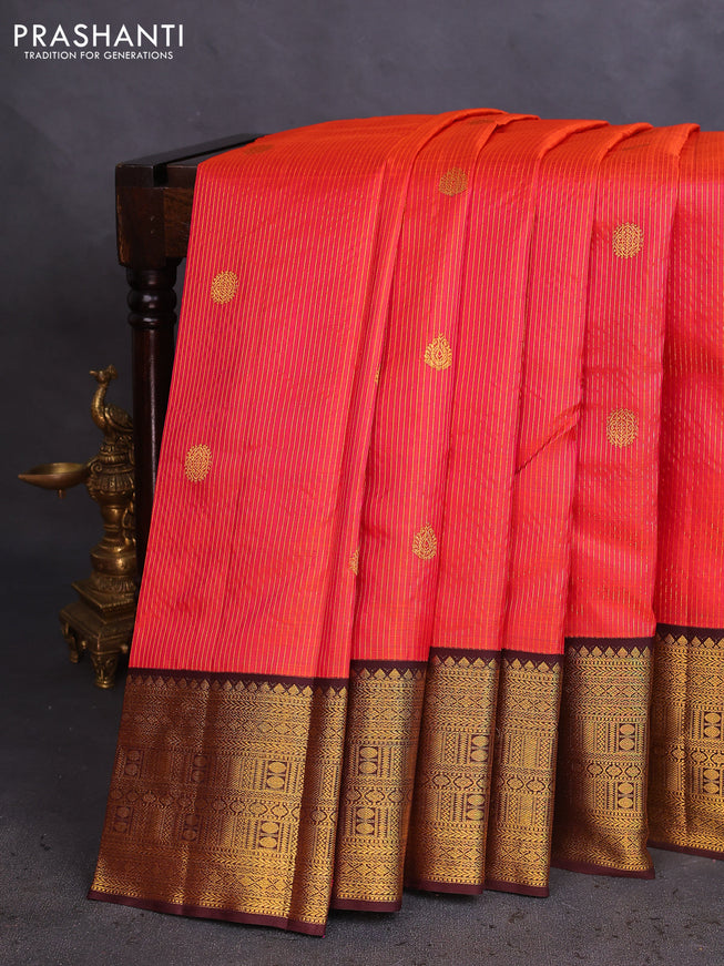 Pure kanchipuram silk saree dual shade of pinkish orange and coffee brown with allover zari stripe & buttas and zari woven korvai border