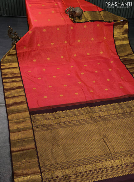 Pure kanchipuram silk saree dual shade of pinkish orange and coffee brown with allover zari stripe & buttas and zari woven korvai border