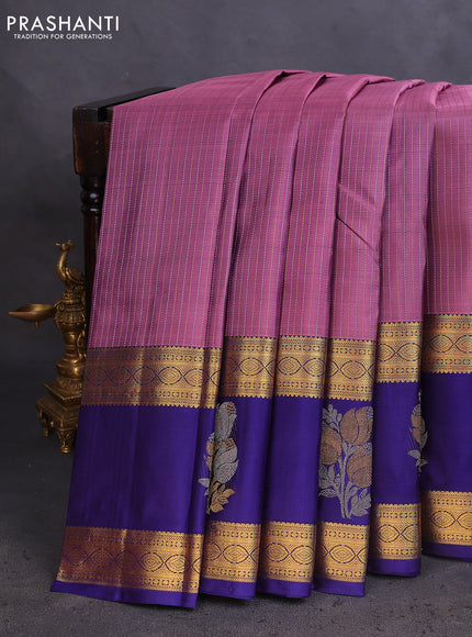 Pure kanchipuram silk saree pastel purple and dark blue with allover zari weaves and long zari woven butta border