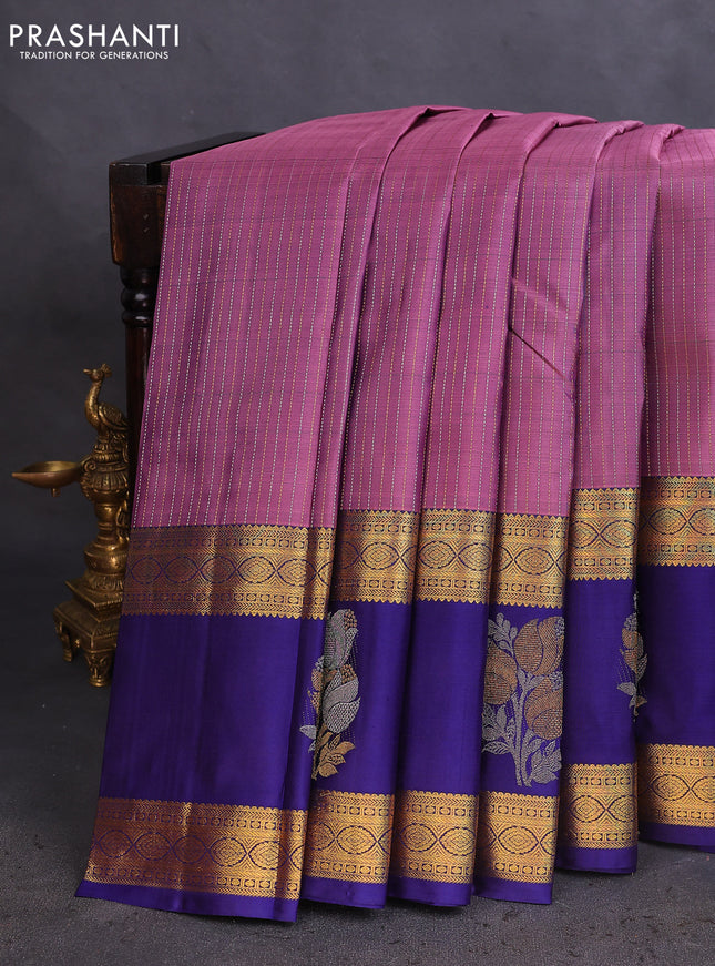 Pure kanchipuram silk saree pastel purple and dark blue with allover zari weaves and long zari woven butta border