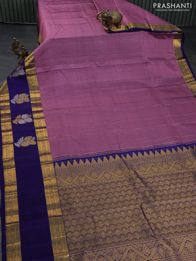 Pure kanchipuram silk saree pastel purple and dark blue with allover zari weaves and long zari woven butta border
